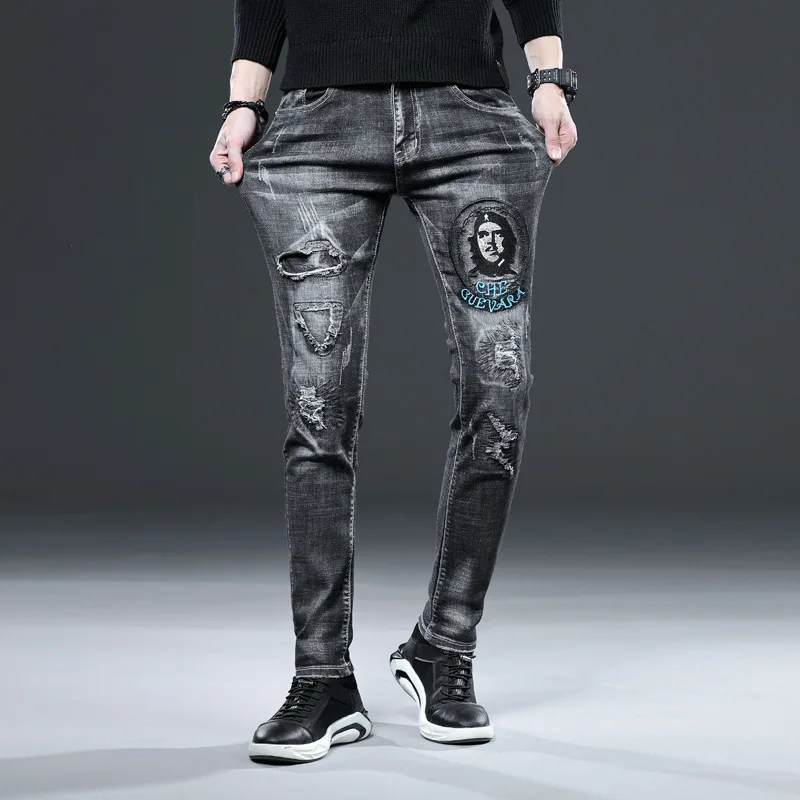 

Europe and the hole in the embroidery flower hole elastic jeans men's cultivate morality and feet men's wear long pants
