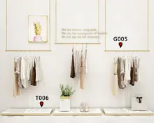 

Clothing store suspends clothes rings, iron ceiling suspends clothes hangers, and the upper wall is retractable.