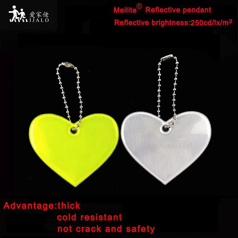 Светоотражающий брелок Meilite 250 candle lights из мягкого ПВХ с отражателем сердца
