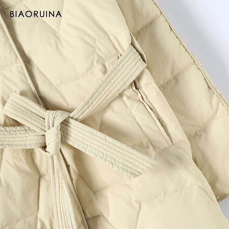 BIAORUINA, женская модная зимняя длинная однотонная стеганая куртка, Женская Повседневная универсальная теплая пуховая куртка с капюшоном и поясом, приталенный крой