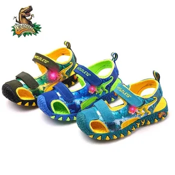 

Dinoskulls Summer Children's Sandals 6 Boys T-rex Glowing Flashing Closed Toe Beach Sandals 8 Kids LED Light PU Rubber Shoes
