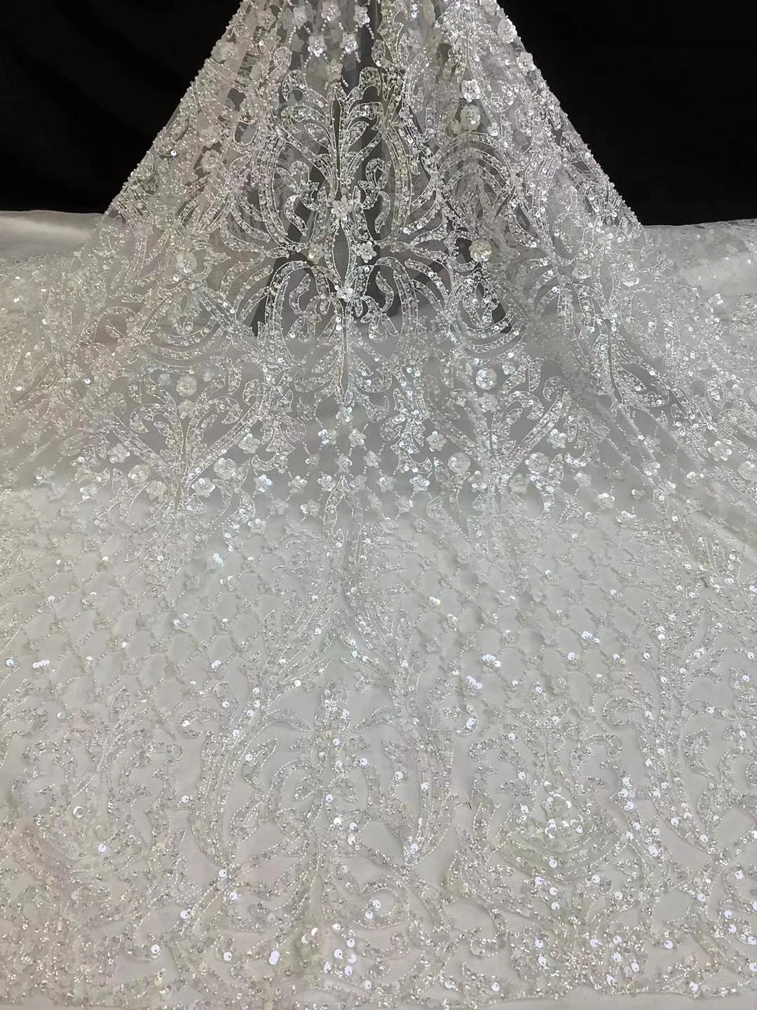https://ae01.alicdn.com/kf/H1f2f9440857343769d2c4f6767987877z/Hot-selling-exquisite-bead-tube-sequin-laminated-white-wedding-dress-embroidery-suitable-for-wedding-dress-ax.jpg