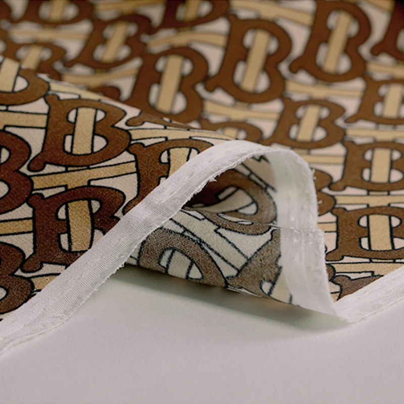 

138cm*100cm Natural Silk Spandex Blended Fabric High End Dress Material Letter Printed 19momme