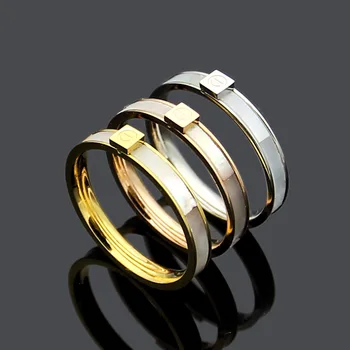 

Titanium steel jewelry screw shell ring couple simple white shell nail pattern ring