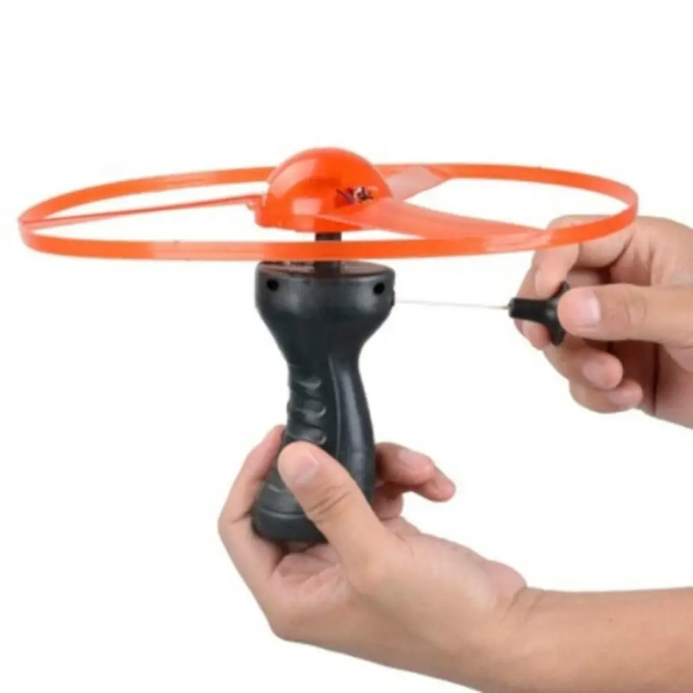 

Funny Spinning Flyer Luminous Flying Ufo Led Light Handle Flash Flying Toys For Kids Outdoor Game Color Random