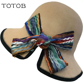 

Korean version of the big bow jacquard fisherman hat female autumn and winter pure wool dome decoration casual temperament cap