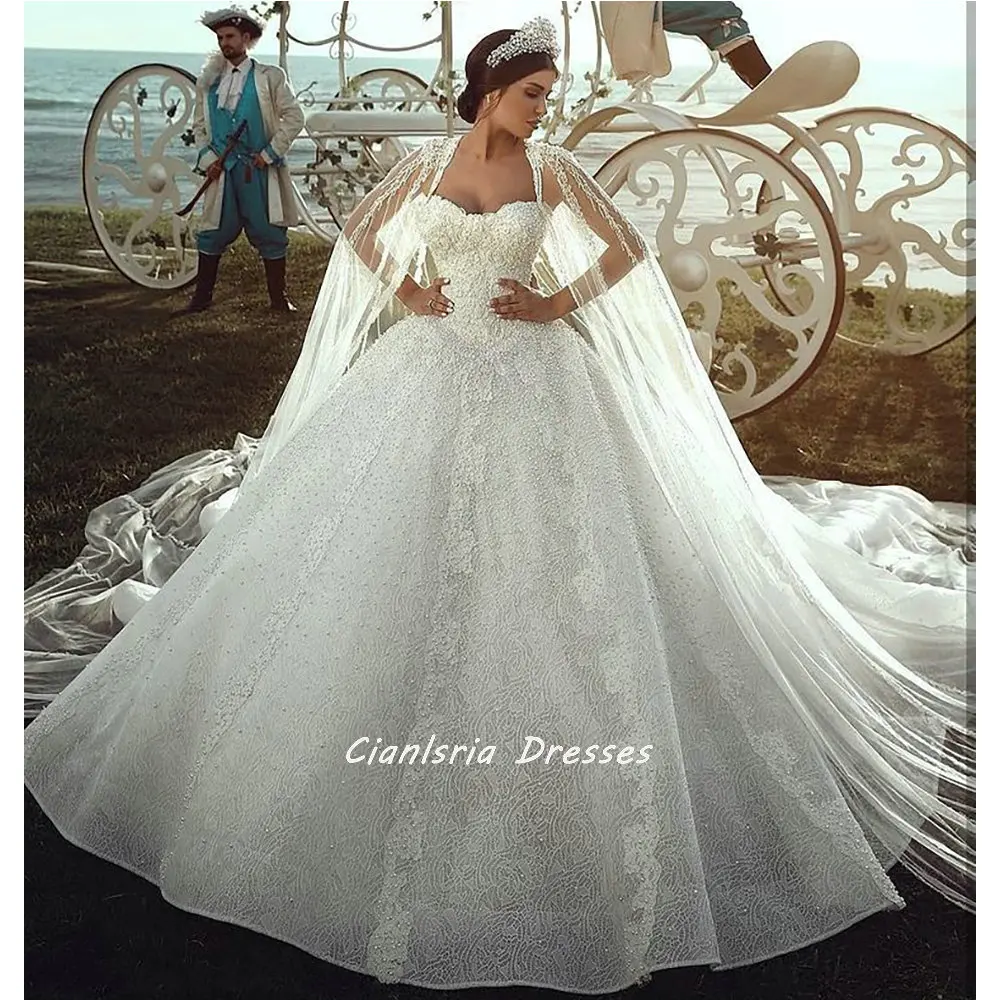 

Romantic Backless Crystal Tulle Dubai Ball Gown Wedding Dresses With Cape Sweetheart Appliques Lace Saudi Arabic Bridal Gowns