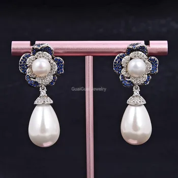 

GG Jewelry White Teardrop Sea Shell Pearl Blue Cz Pave Flower Stud Earrings