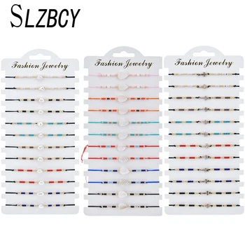 

Boho 12pcs/lot White Pearl Feather Charms Seed Beads Bracelets Set Weave Adjustable Knot String Braided Wristband Jewelry Gift