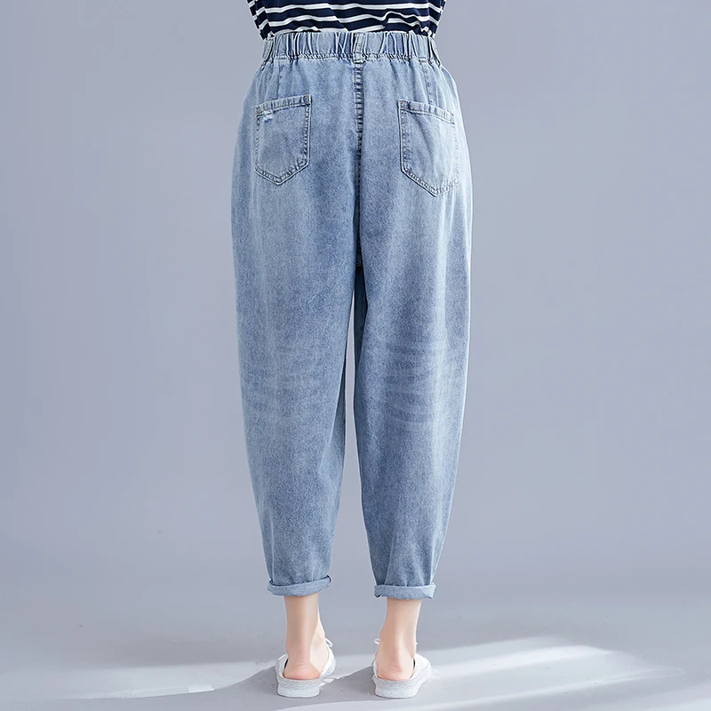 Real shot spring new women's wash water denim pocket solid color hole elastic nine points harem pants wild