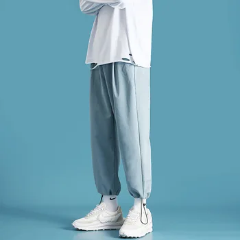 

Men's and women's sweatpants 2020 autumn black men's casual trousers solid color strappy track pants