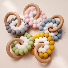 

Bite Bites 1PC Food Grade Silicone Feather Teether Chewing Custom Bracelets Baby Care Products Wooden Teething Ring Baby Teether