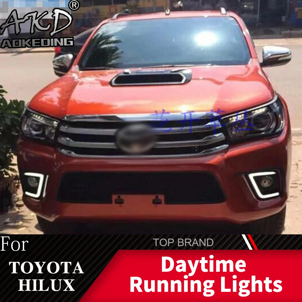 

AKD 2PCS LED Daytime Running Light For Toyota Hilux Revo 2015 2016 Yellow Turn Signal Function 12V Car DRL Fog Lamp Decoration