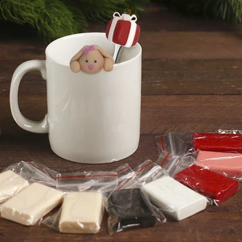

A set for creativity. Mug with a spoon for decoration with polymer clay " Bunny with a gift»