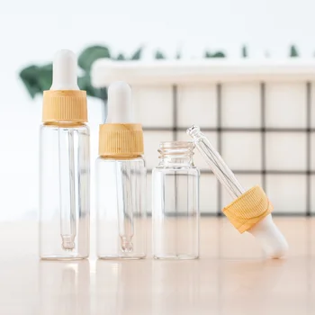 

1pcs 5/10/15/20ml Glass Dropper Dispenser Bottle Wood Grain Essential Oil Liquid Refillable Bottles Portable Cosmetic Containers