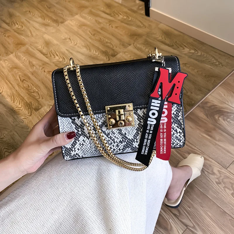 

2019 new bump snake skin pattern small square bag pig nose button hanger single shoulder skew cross bag. handbag women bag