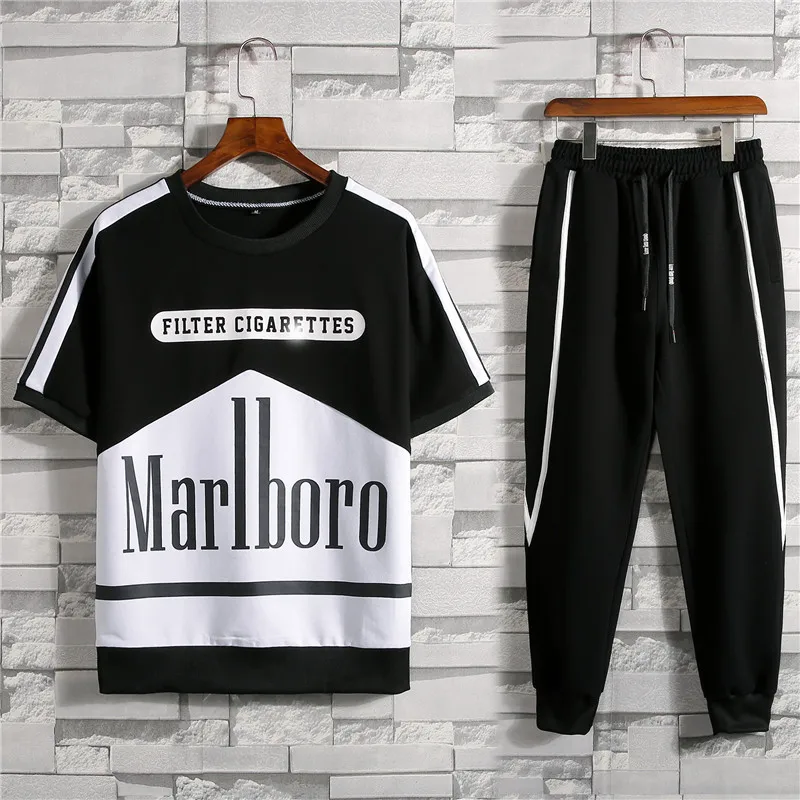 

Men's New Style Short Sleeve Set Summer Korean-style Fashion Leisure Sports Suit Black And White Stitching T-shirt Trousers Men'