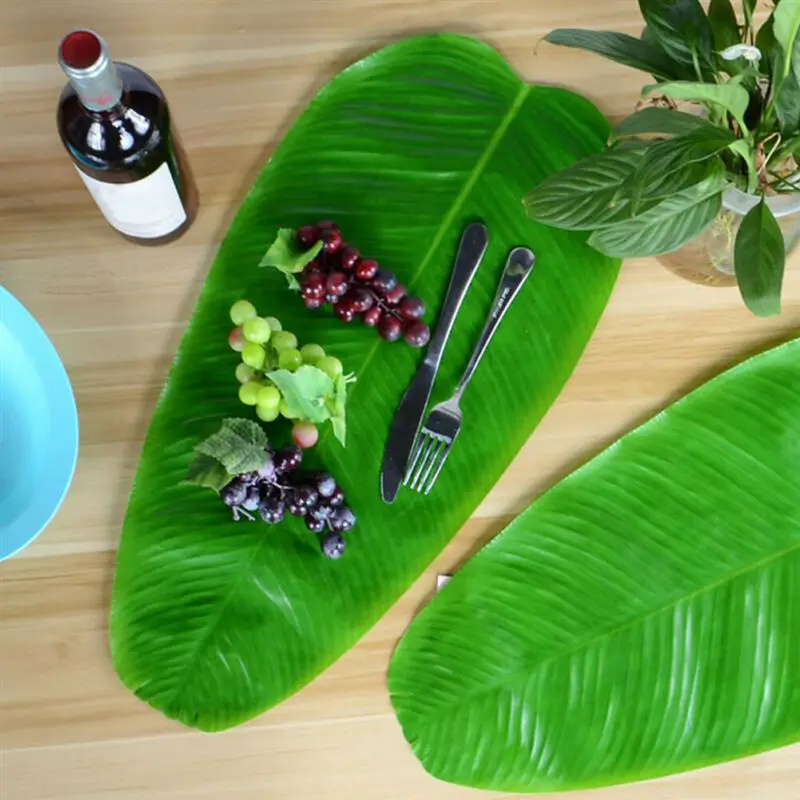 

4 pcs Simulation Banana Leaf Placemat Table Mat Artificial Leaves or Hawaiian Jungle Party Supplies Table Decorations