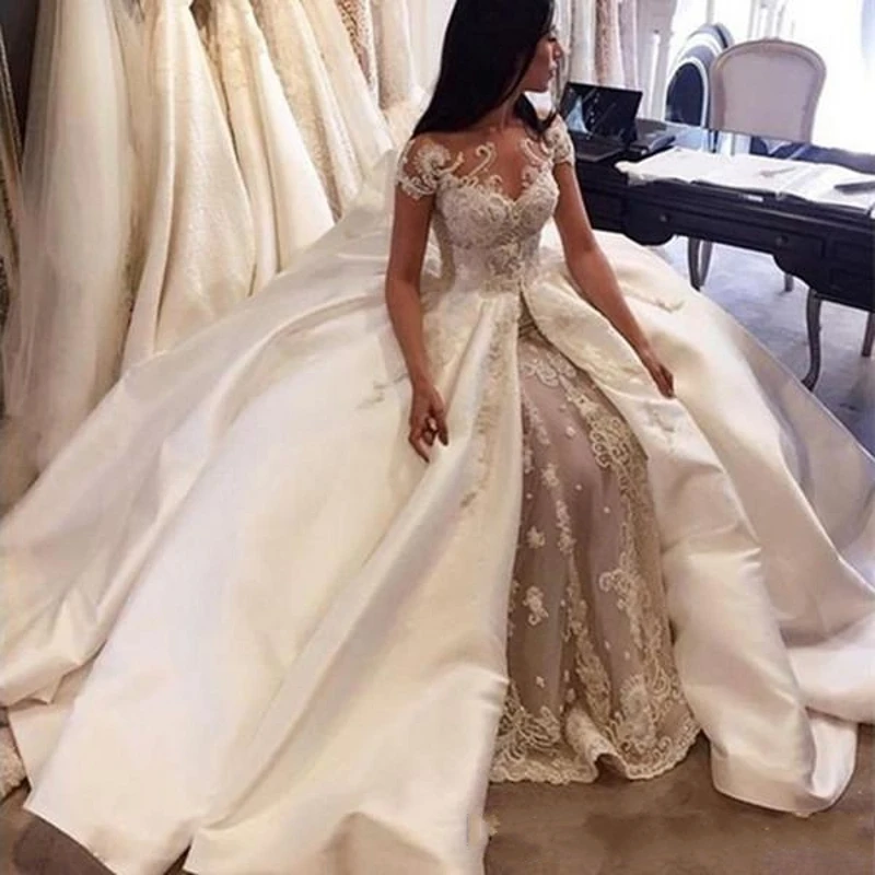 

Luxury Ball Gown Wedding Dresses 2019 Saudi Arabia Cap Sleeve Lace Applique Satin Overskirt Bridal Gowns Dubai Wedding Dress