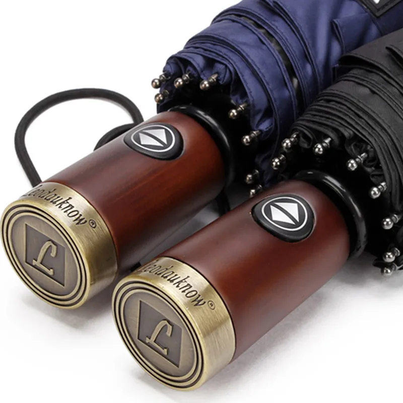 Online Leodauknow Business completamente automático tres plegables a prueba de viento mango de madera sólida con metal de los hombres de sol y lluvia paraguas