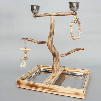 

Natural wood parrot standing in a cage feeding cup bird chew biting toy parrot playing platform parrot tree perched WF629256