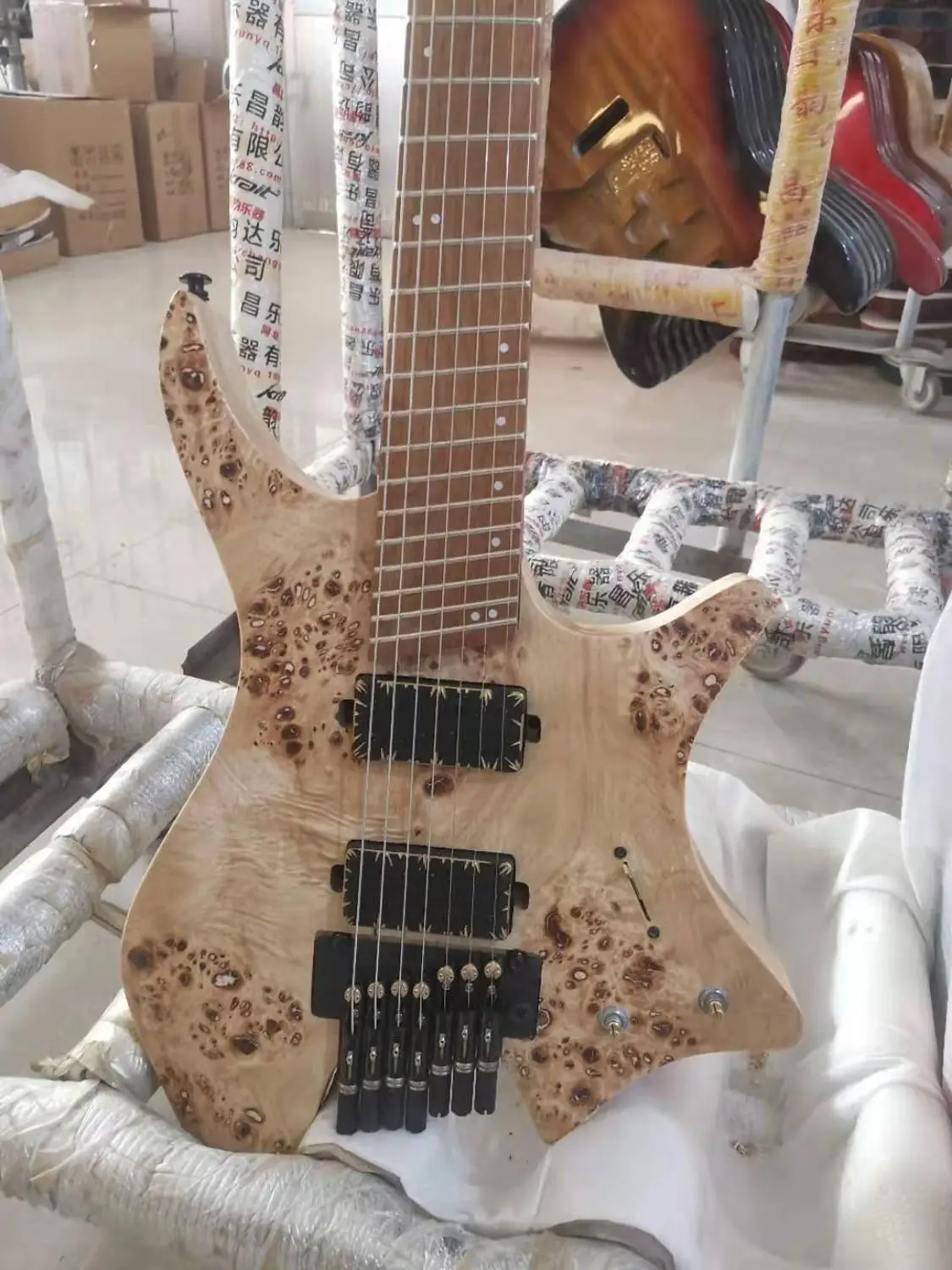 

Krait 7 string headless guitar with tremolo ash body burl top roasted maple neckfree shipping