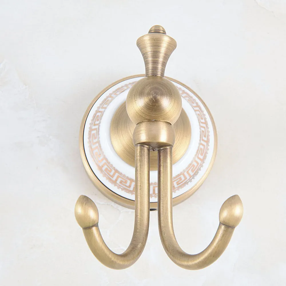 

1Pcs Antique Brass Ceramic Base Pattern Wall Mounted Double Robe Hooks Coat Hat Towel Hook Hanger Bathroom Accessory aba576