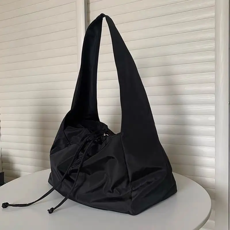 Retro female bag pumping strap tote canvas big Korean version of large-capacity nylon wild Harajuku student underarm |