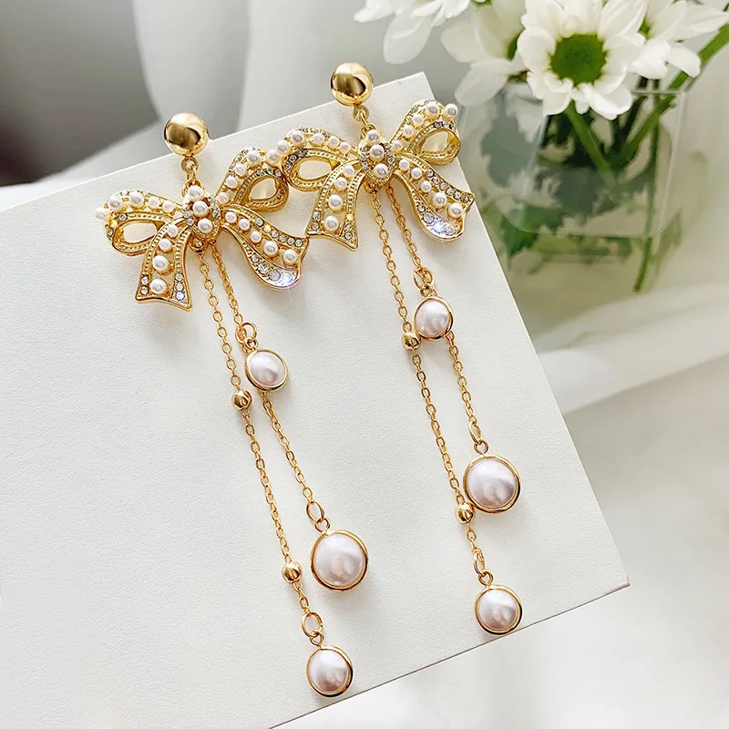 

Vintage Bowknot Women Dangle Earrings Personality Bow Pearl Fringed Earrings Bohemian Fashion Earrings For Women Statement