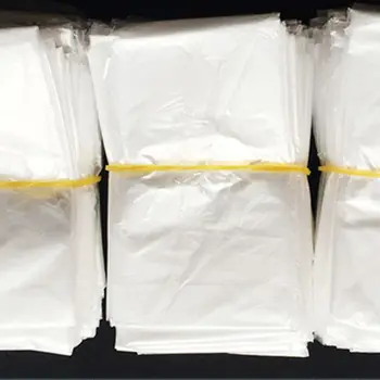 

100Pcs Disposable Waterproof Barber Cape Hairdressing Shawl Barbershop Apron X7JA