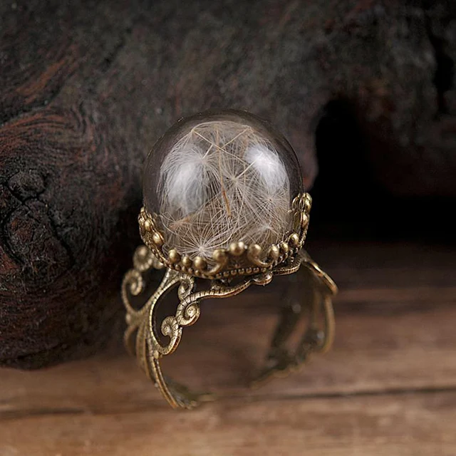 Affordable and stylish ring with real dandelion seeds.