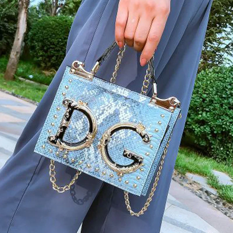 

Snakeskin bag female 2020 fashion rivet small square bag personality creative single shoulder messenger fairy hit color bag