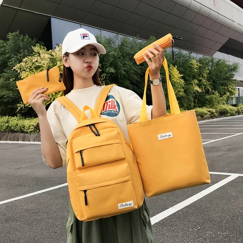 

Four piece set large capacity student bag Korean high school ancient sense girl fashion brand ins style simple Backpack