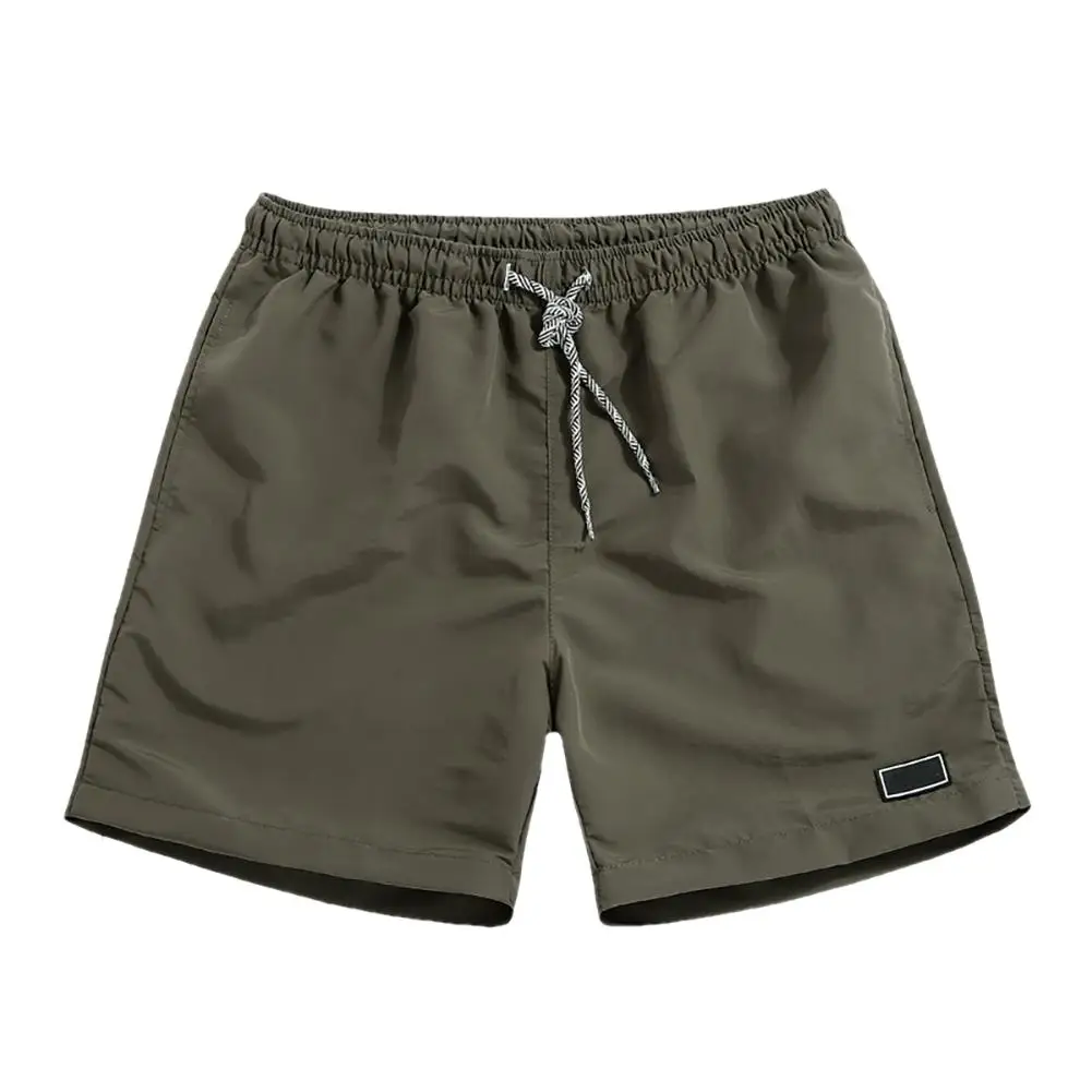 Pantalones secos rápidos transpirables para hombre, pantalones cortos deportivos informales de poliéster con bolsillos, Color sólido de playa, lavado a mano Regular con bolsillos, transpirables