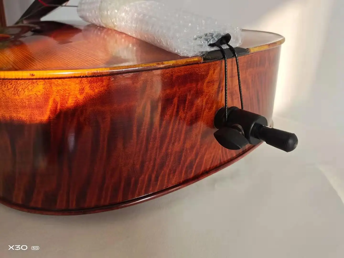 handcrafted 4/4 cello with a solid wood frame