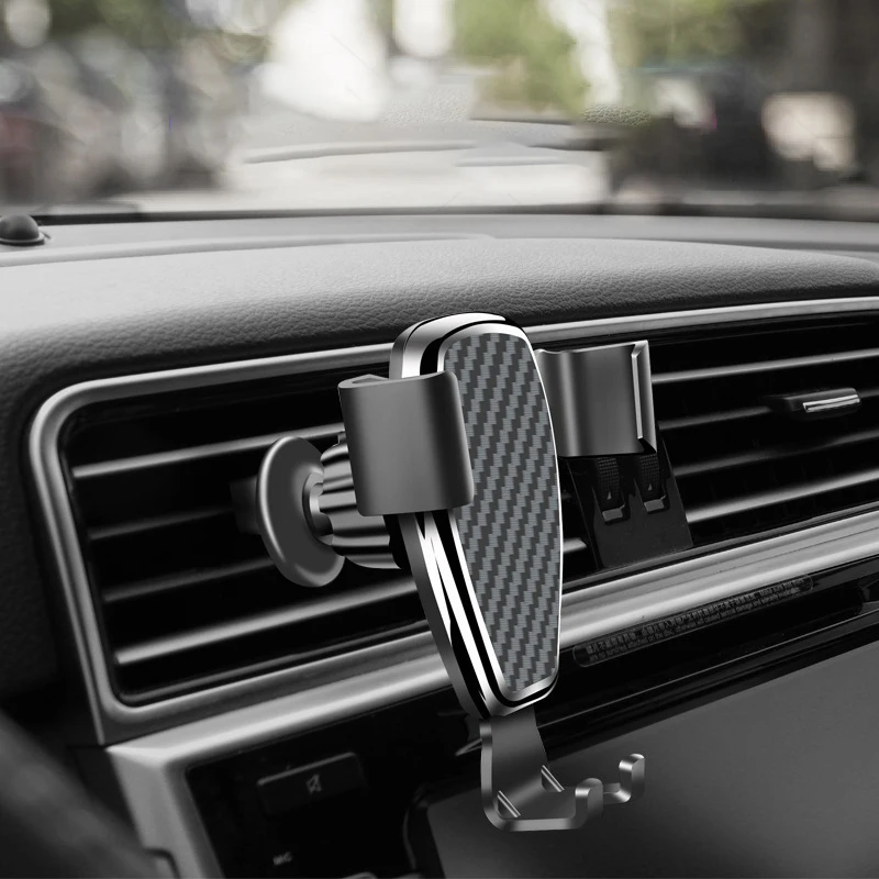 

Carbon fiber car mobile phone bracket for iphone11 gravity snap type air outlet universal bracket car navigation support
