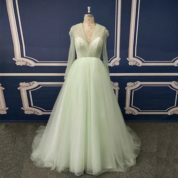 

Green Deep V Neck A Line Pearls Girls Dancing Prom Dress with Long Sleeve