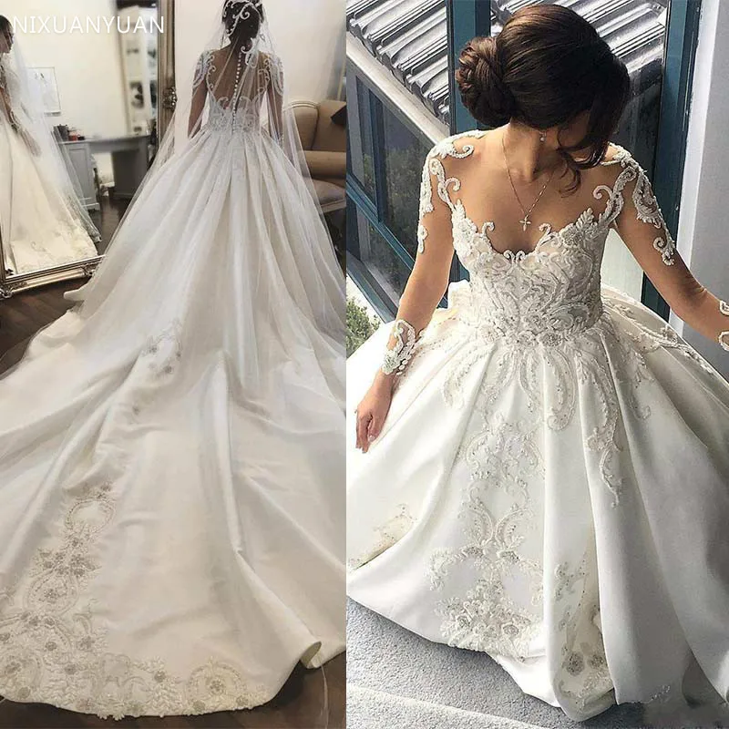 New Glamorous Lace Wedding Dress Illusion Long Sleeves Wedding Gown Sheer Neckine Covered Button Back Wedding Bridal Gowns