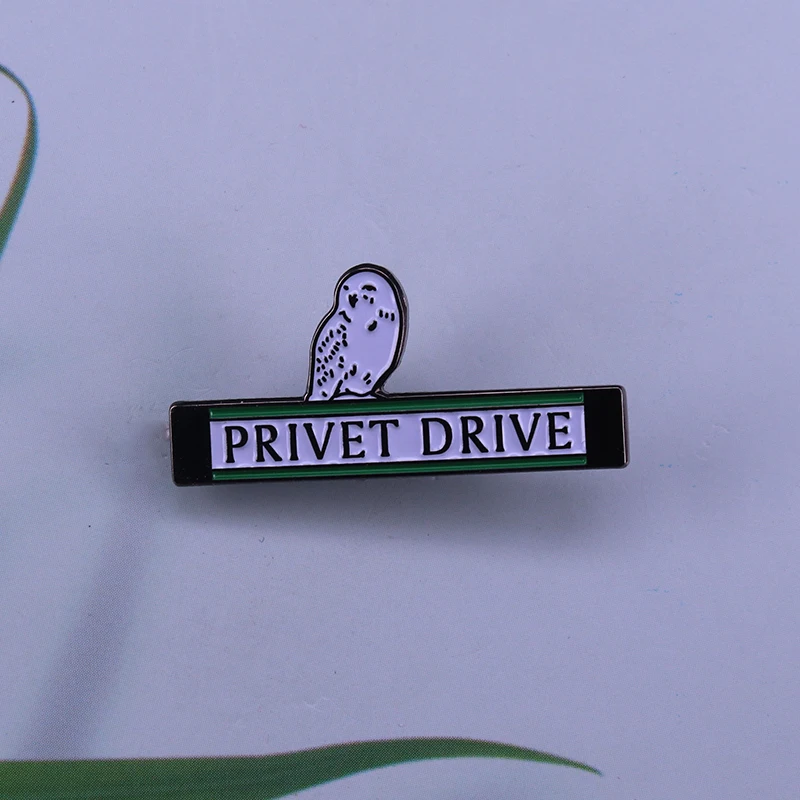 Cute Hedwig enamel pin the snowy owl perched on the Privet Drive
