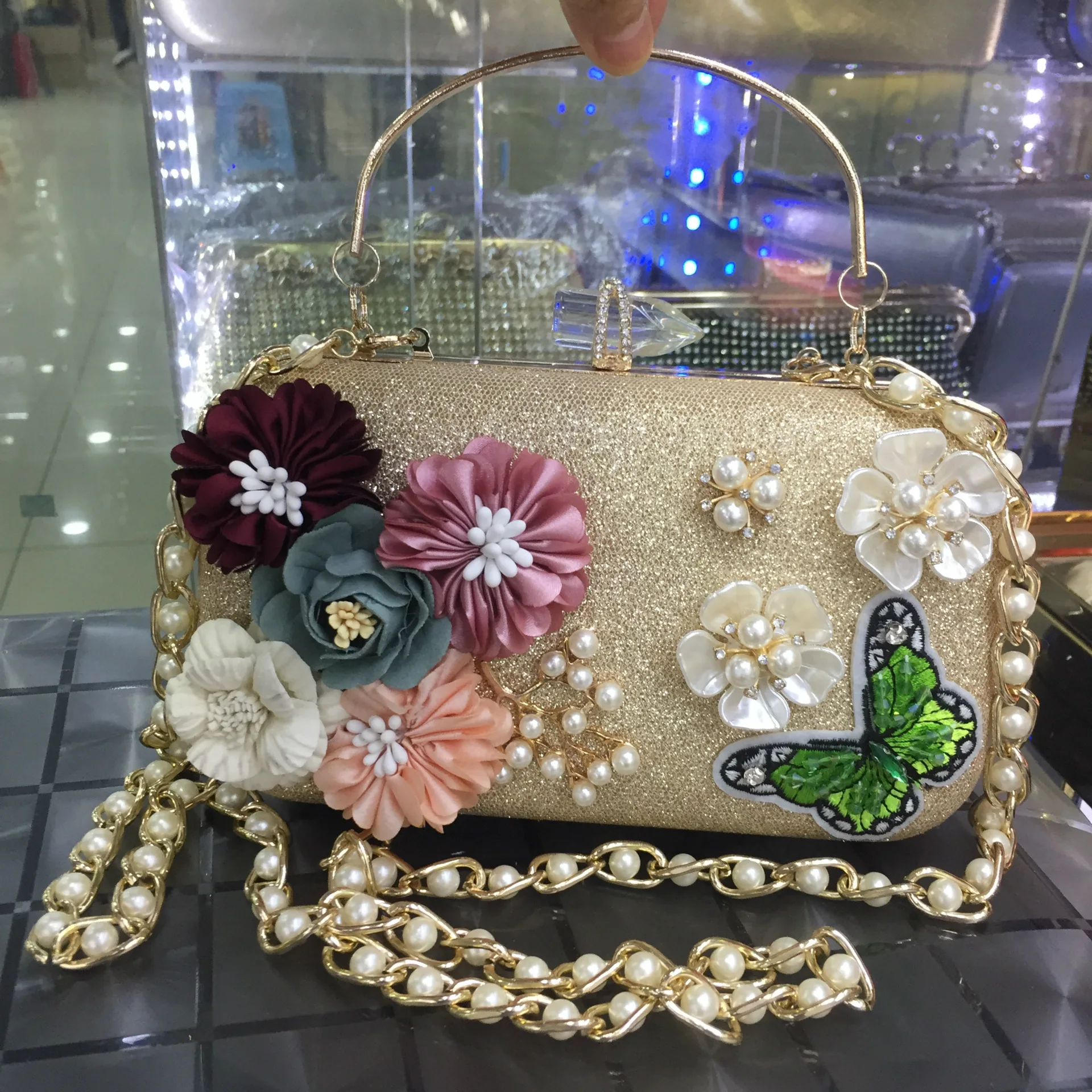 sizzling golden metal frame ladies purse with sling chain Delivery in  Bangalore - redblooms