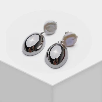 

Amorita boutique drop Earrings with a mirror on them