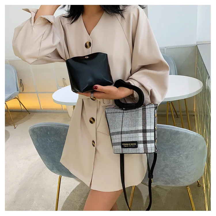 

Irregular texture handheld ladies and babies new fashion inclined vertical bucket bag for summer style in 2019