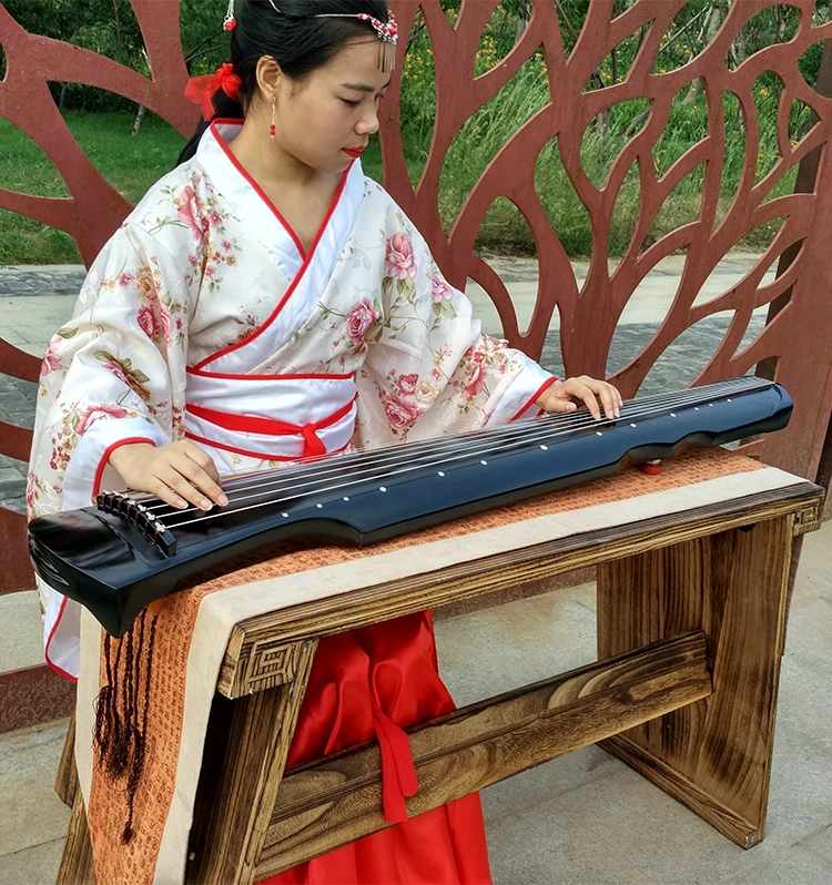 Китайская цитра guqin. Цитры цинь музыкальный инструмент. Музыкальный инструмент цинь. Китайский инструмент гуцинь. Цитра гуцинь.