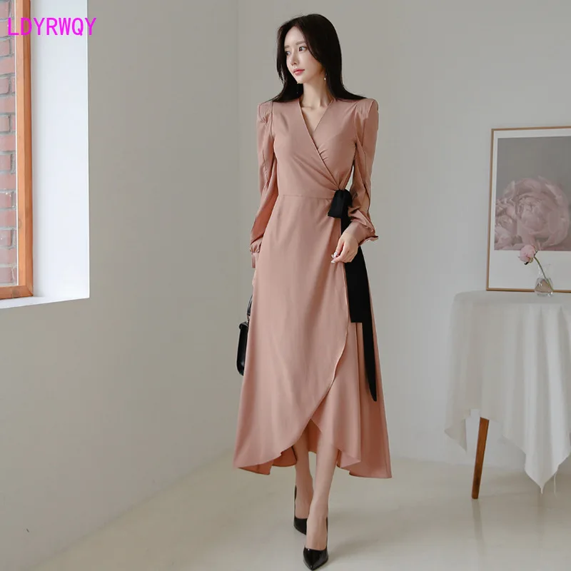 

2019 Korean version of autumn fashion women's temperament V-neck open sleeves long section with bow irregular dress