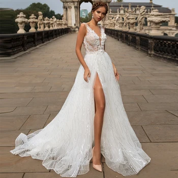 

Booma Sparkling Tulle Wedding Dresses High Quality 2020 Sexy Deep V-neck Lace Appliqued Beach Boho Shiny Bridal Gowns with Split