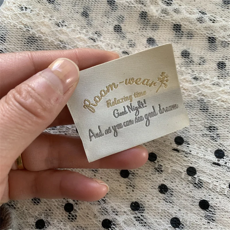 High Density Beige Background Washable Soft Quality Woven Cloth Labels For Clothing