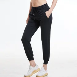 Leggings moulants de Sport pour femmes, en tissu extensible, coupe ample, avec deux poches latérales, pantalon camouflage longueur cheville 