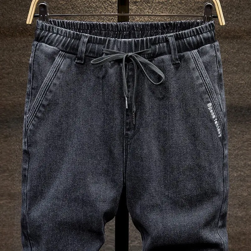 Koop Zwart Grote Maat Jeans Mannen Plus Size College Harembroek Herfst Elastische Stretch Voeten Broek 7XL 6XL 5XL