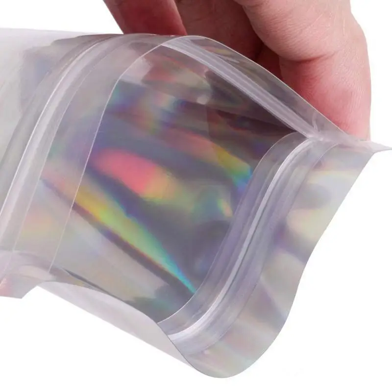Resealable-Mylar-Bags-Holographic-Color-Multiple-Size-Smell-Proof-Bags-Clear-Zip-Lock-Food-Candy-Storage.jpg Learealsikai Mylar Backs Holografikus Színű Több Méretű Szaggalálló Zsákok Tiszta Cipzárral Rendelkező Ételek Cukorkák Tárolócsomagoló Táskák - Image 6