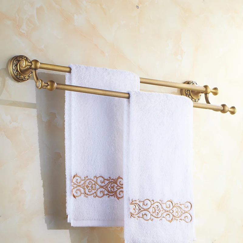 The bathroom uses the old brass two lane towel hung on the wall, the bathroom towel rack